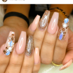 Beige nail design blue rhinestone