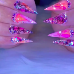 Pink and orange rhinestone stiletto nails