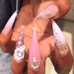 Pink and gold glitter stiletto nail design