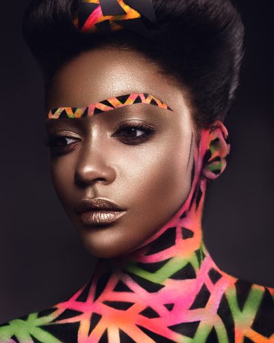 Beautiful woman with colored futuristic make up